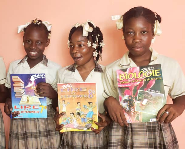 Haitian students receive school supplies.