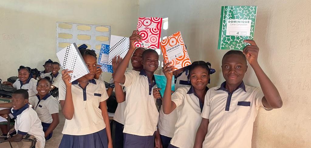 Haitian students excited about school supplies.