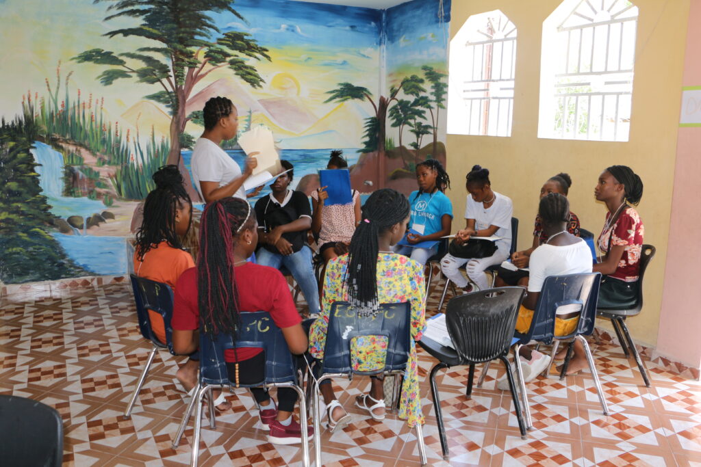 Haitian teens attending a Bible study at Camp Hope