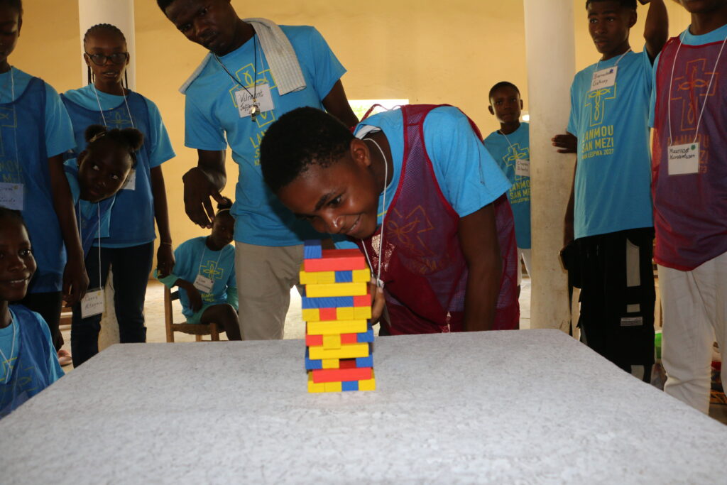 Haitian teens enjoying games at Camp Hope