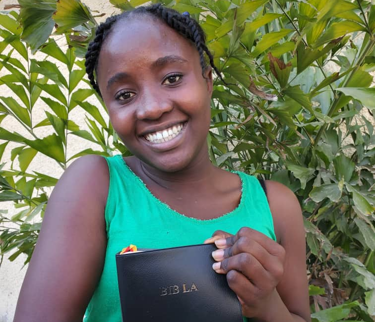 Haitian child with a Bible